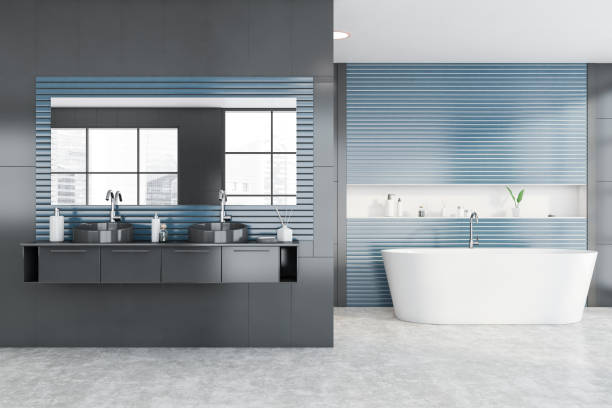 istock Gray and blue bathroom with tub and sink 1225360837