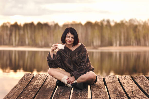 istock young girl drinks coffee outdoors emotions 1225361912