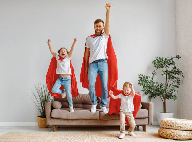 istock Joyful father and children having fun at home 1225362038