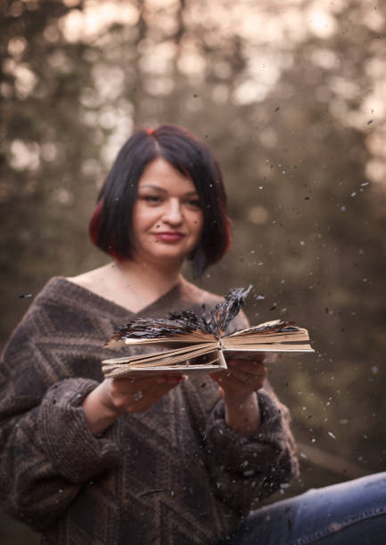 istock young woman with a burned book 1225362302