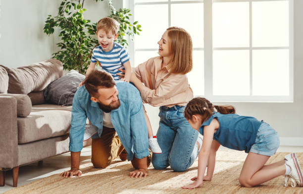 istock Happy family having fun at home 1225364042
