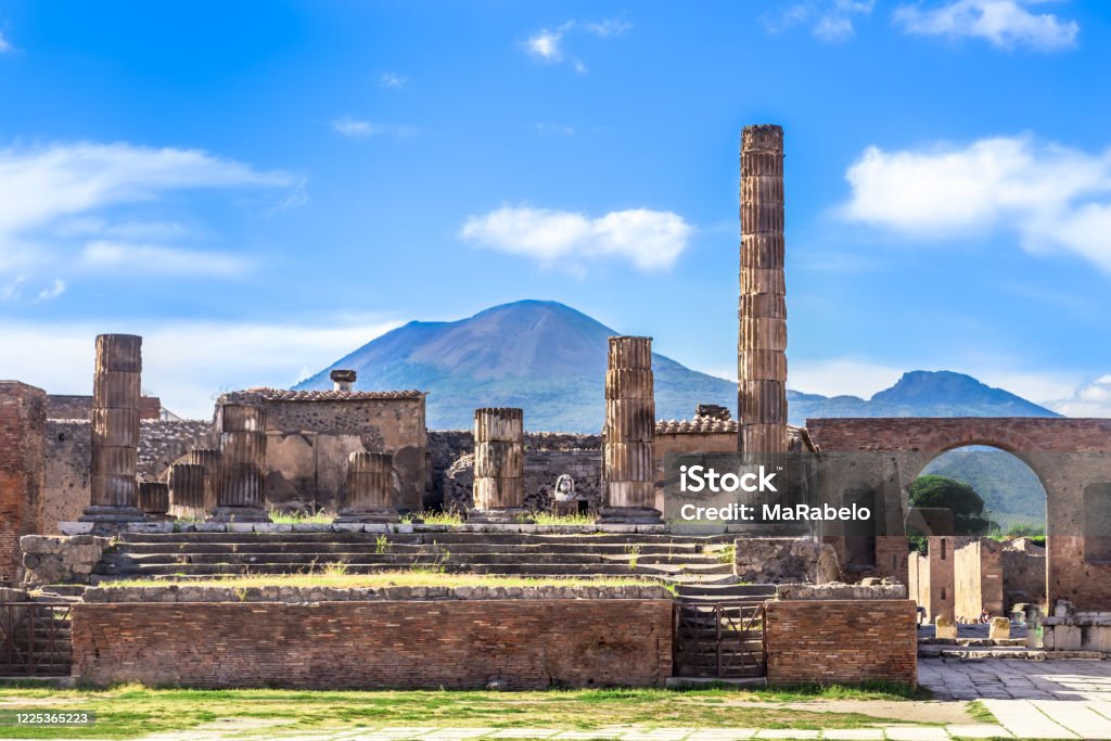 Pompeii in Italy, ruins of the antique Temple of Apollo with bronze Apollo statue, Naples. Pompeii Stock Photo