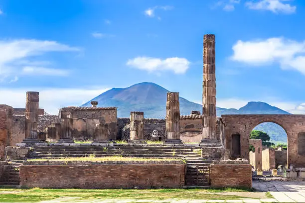 Pompeii in Italy, ruins of the antique Temple of Apollo with bronze Apollo statue, Naples.