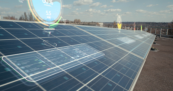 Long shot of holographic indicators showing efficiency levels of solar panels on rooftop