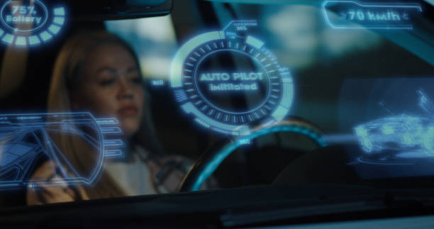 istock Woman engaging self driving mode in car 1225366332