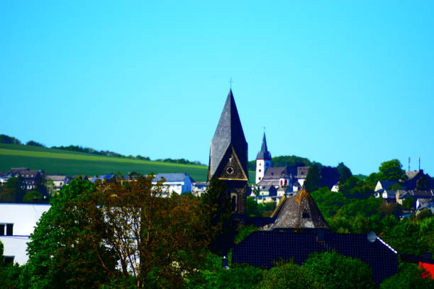 istock church tower over German village 1225368685