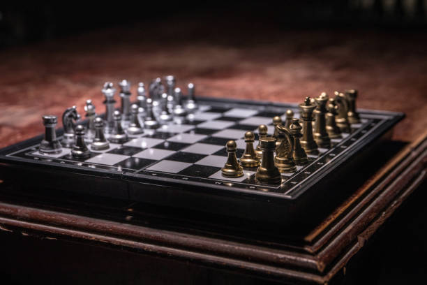 istock Chess figures on a dark background with smoke and fog. Selective focus 1225370352