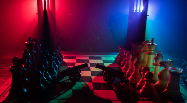 istock Chess figures on a dark background with smoke and fog. Selective focus 1225370376