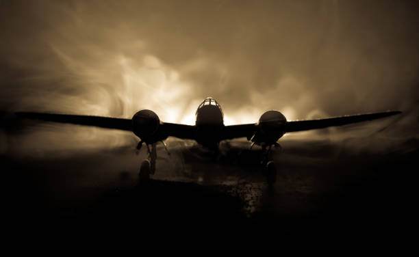 German Junker (Ju-88) night bomber at night. Artwork decoration with scale model of jet-propelled plane in possession.