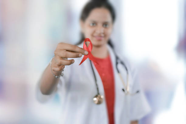 istock Doctor Holding Aids Awareness Ribbon 1225370656