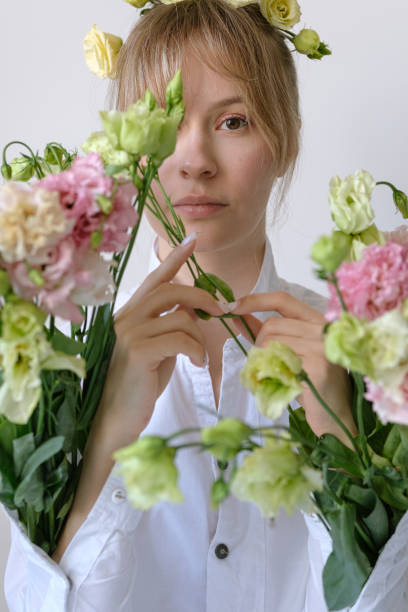 istock Woman holds flowers in her hands 1225371731