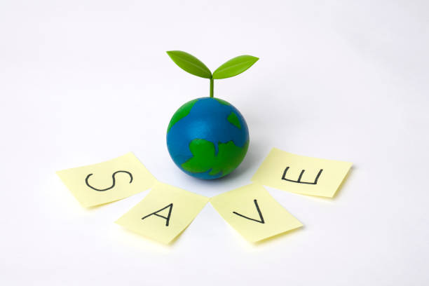 istock green sprout on globe with white background 1225371927