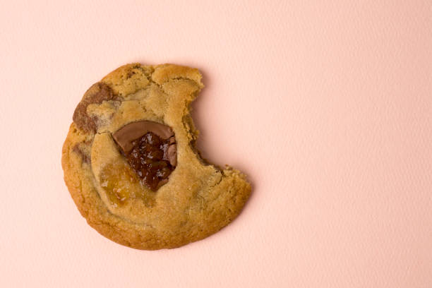 istock delicious chocolate chip cookie on pink background 1225371936