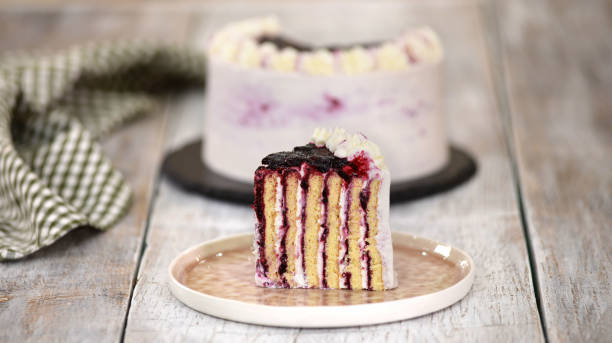 istock Piece of Homemade Vertical Layer Blackcurrant Jam Cake 1225375545