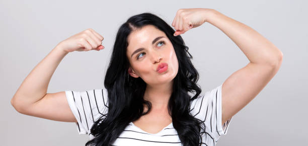 istock Powerful young woman in success pose 1225375705