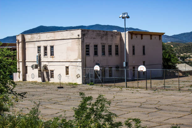 Outdated Retro Two Story School With Play Yard Area