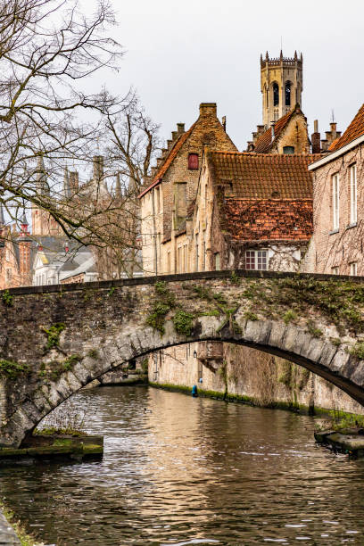 istock Buildings around channels and bridge in Bruges 1225381576