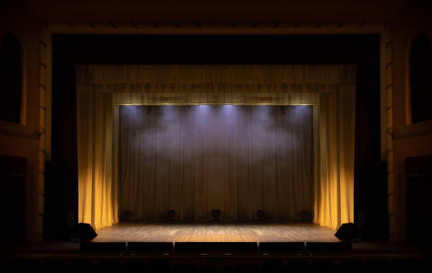 istock Theater lights spotlights and smoke over the stage 1225382301