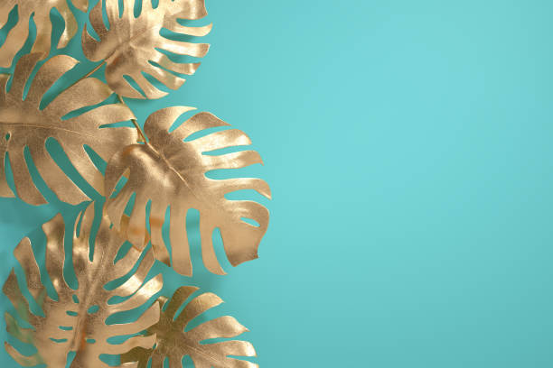 istock Gold tropical palm leaves 1225383313