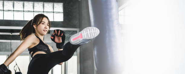 istock Athlete woman doing kick boxing training 1225384781