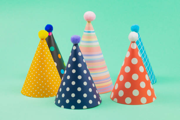 istock Colorful birthday caps on mint background. 1225384966