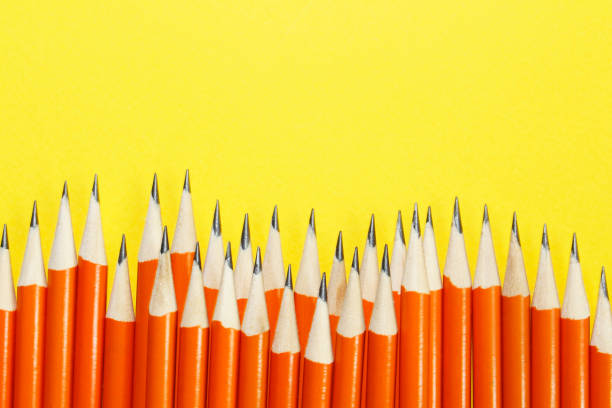 istock Black lead pencils on a yellow background. 1225386590