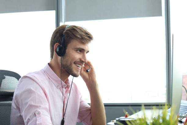 istock Happy young male customer support executive working in office. 1225387021