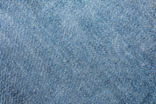 selektive fokus blaue jeans-denim-top-ansicht nah aufnahme bis zum detail des gewebes. textilmaterial und baumwolle patter zäh und langlebig kleidung stil. für hintergrund oder hintergrundbild mit kopierraum für text - fashion rough jacket garment stock-fotos und bilder