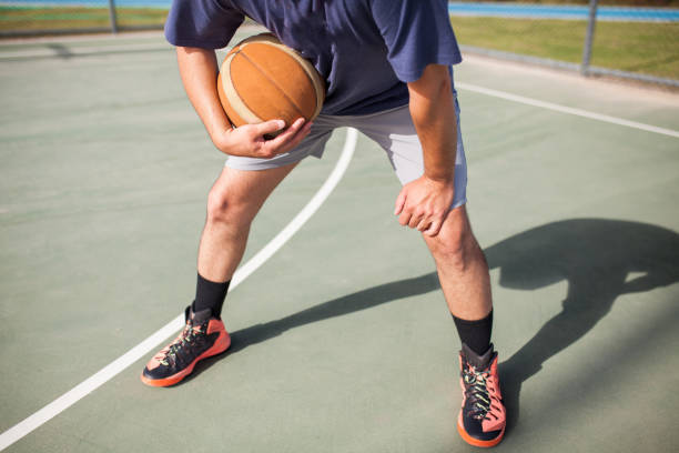 istock Man playing basketball at outside 1225389026