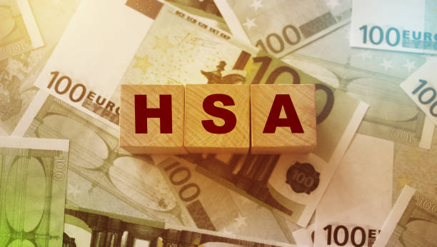 Wooden blocks with the word HSA standing for Health savings account put on 100 Euro bills. Healthcare, life insurance, medical expenses concept Wooden blocks with the word HSA standing for Health savings account put on 100 Euro bills. Healthcare, life insurance, medical expenses concept. free syrian army stock pictures, royalty-free photos & images