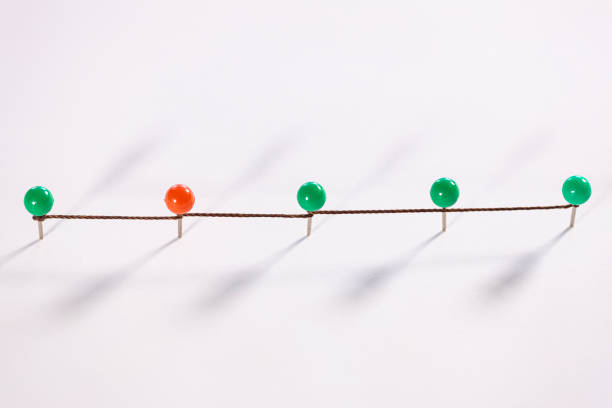 Line of thumbtacks. Social distancing concept