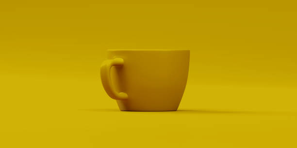 istock yellow cup of dark coffee on a yellow background 1225391048