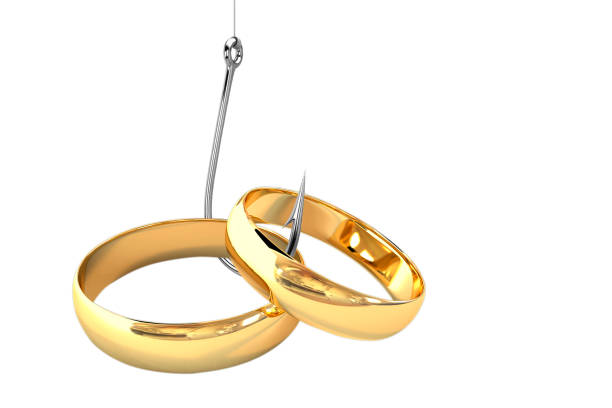 trampa de celibato y matrimonio - golden handcuffs fotografías e imágenes de stock