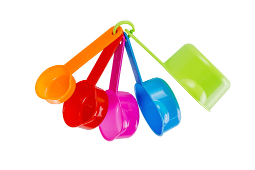 Plastic measuring cups isolated on white background