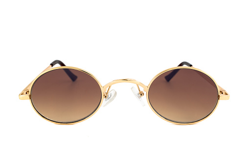 Vintage sunglasses with small oval shaped gold wrap around frames and brown gradient lenses, isolated on white background, front view.