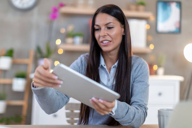 istock Young woman freelancer with modern technology. 1225398935