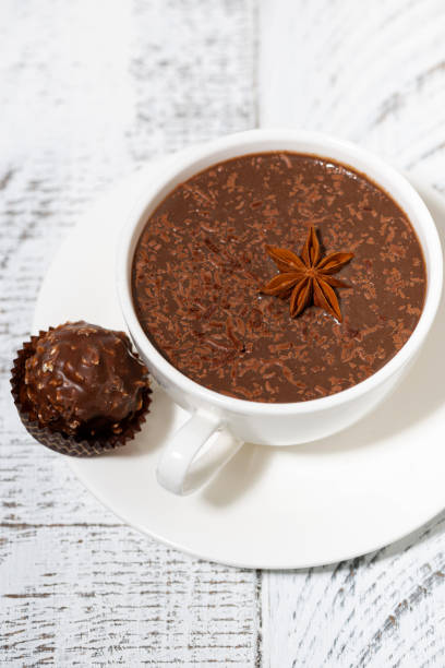 istock cup of hot chocolate and chocolate candy, vertical 1225399043