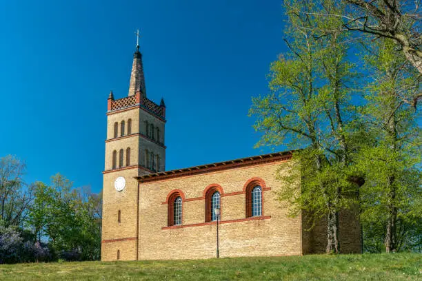 The historical village church in Petzow, Brandenburg, Germany on a bright sunny spring day