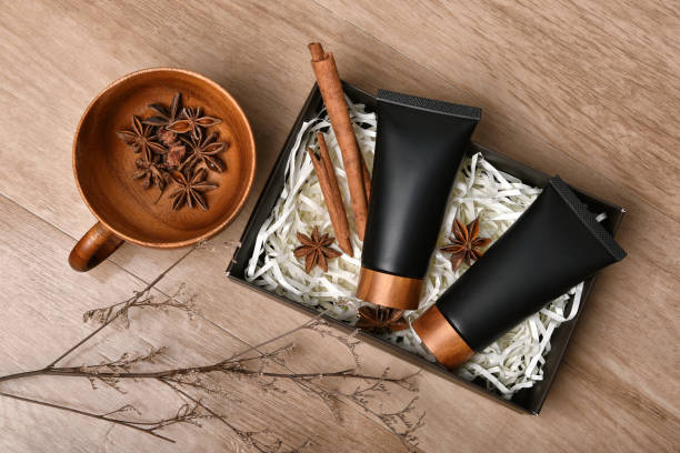 istock Cosmetic black bottle containers packaging with cinnamon and anise aromatherapy oil essence extract, Blank label for organic herb branding mock-up, Natural skincare beauty product concept. 1225403494