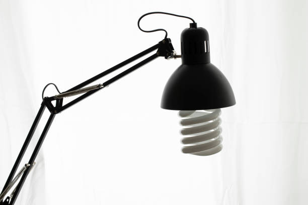 istock Table lamp in black color. Large spiral lamp is installed. 1225403652