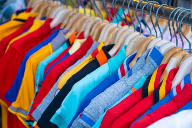 istock Multi-colored t-shirts on a hanger. Clothing store 1225406929
