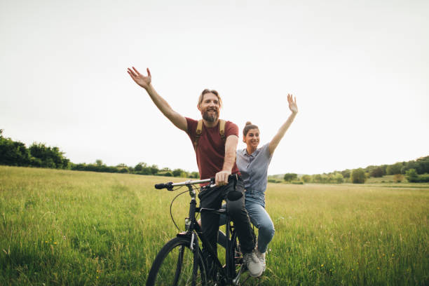 istock Happy couple enjoy cycling 1225407423