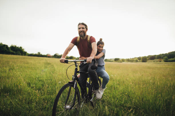 istock Happy couple enjoying bicycle ride 1225407425
