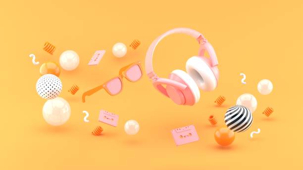 istock Headphones and glasses float between the balls on the orange backdrop. 1225407432