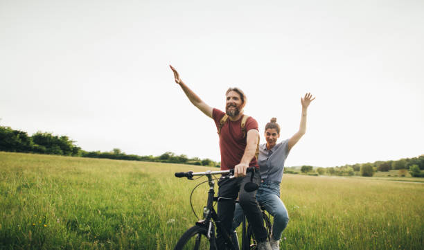 istock Happy couple enjoy cycling 1225407542
