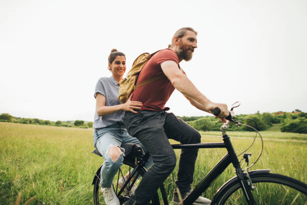istock Happy couple enjoying bicycle ride 1225407551