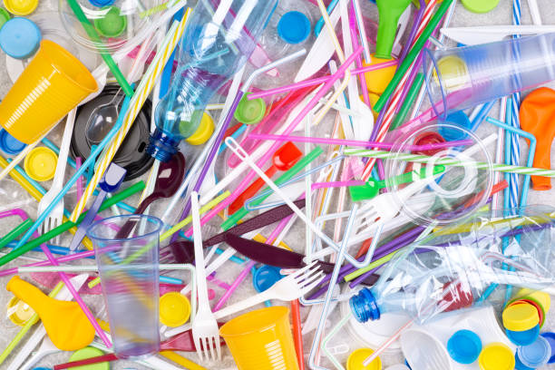 istock Disposable single use plastic objects cause pollution of the environment, top view 1225408316