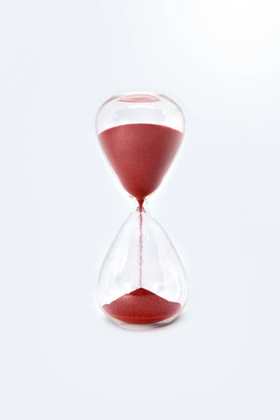 istock Hourglass sandglass clock isolated on white background. close up view. close up 1225409940