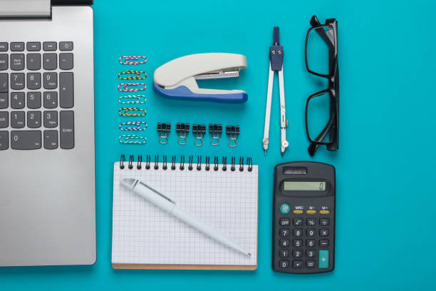 istock Flat lay composition of office tools, stationery on blue background. Top view 1225410269