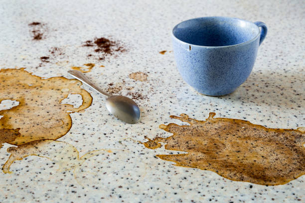 istock The empty blue cup is on the dirty table and there is a teaspoon. Cup marks, coffee stains on the surface. Close up composition. 1225415129